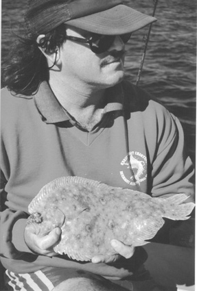 The author with a lovely flounder caught in a local estuary.